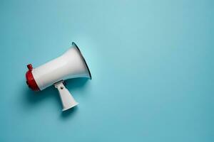 AI generated Megaphone or hand speaker isolated on blue background with copy space photo