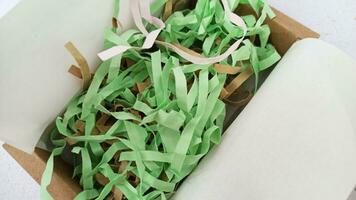 Paper strips in a gift box, close-up, selective focus photo