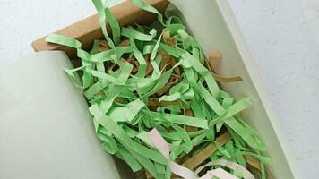 Paper strips in a gift box, close-up, selective focus photo