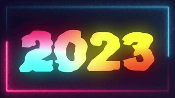 New year colorful neon lights 2023 displayed in blue and pink laser or fluorescent light showing a box pattern on a black background. video