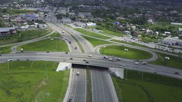 Aerial view overpass traffic with car move transport background. Clip. Aerial view at junctions of city highway. Vehicles drive on roads. photo