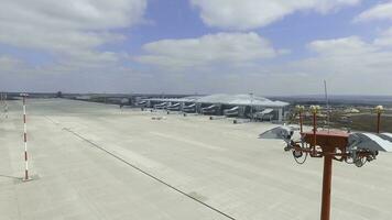 Aerial view of the modern international airport terminal. Traveling around the world. Empty airport aerial. View of runway at the airport. Airfield marking on taxiway is heading to runway photo