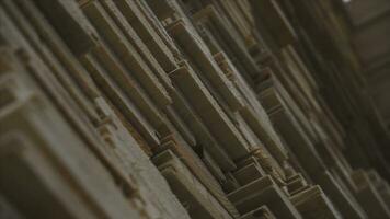 Background of the square ends of the wooden bars. Wood timber construction material for background and texture. close up. Stack of wooden bars. small depth of field. plywood boards on the furniture photo