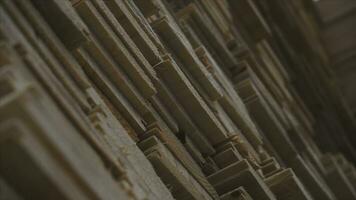 Background of the square ends of the wooden bars. Wood timber construction material for background and texture. close up. Stack of wooden bars. small depth of field. plywood boards on the furniture photo