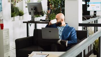 Business manager reviews analytics, examining annual results on online documents in coworking space. Analyst working with company statistics for research plan to create presentation. photo