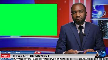 Newscaster does report with greenscreen on live tv program, presenting latest news in newsroom using isolated mockup chromakey template. Media journalist does world advertisements. photo