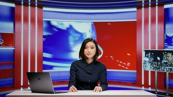 Media broadcaster talks about latest events on tv program, covering all topics in news studio. Professional reporter presenting breaking news for international television, advertisement industry. photo