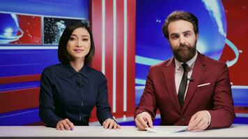 Diverse journalists hosting morning show live on tv program, presenting breakfast talk show on television. Team of reporters covering all breaking news topics, addressing daily international events. photo