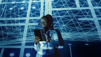 Happy IT consultant looking at artificial intelligence human brain simulation hologram. Overseeing supervisor uses device to harness AI technology power, interacting with AR visualization photo
