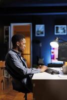 Male programmer working on developing new html script, typing binary code on terminal window. Young web developer does debugging work with coding language, database internet security. photo