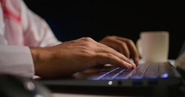 Close up shot of businessman using laptop keyboard and touchpad in office to send emails. Business executive typing on notebook, composing documents in order to deliver finalized project paperwork photo