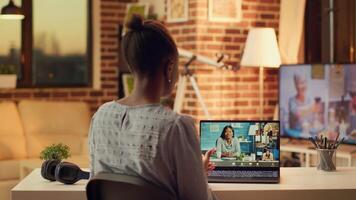 Woman meeting with clients on videocall, explaining price list and services provided to build strong online career in freelancing. Person using telework remote call at home, sunset light. photo