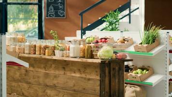 Bulk products in recyclable glass jars used by zero waste eco store eliminating use of plastic for nonpolluting sustainable lifestyle. Local supermarket pantry supplies and eco friendly produce. photo