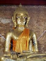 Golden buddha statues, Buddha statue at the ancient temple, peaceful image of a Buddha statue, ancient buddha statues south east asia, Temple Wat Chedi Luang Ancient Ruins Chiang Saen, Chiang Rai photo