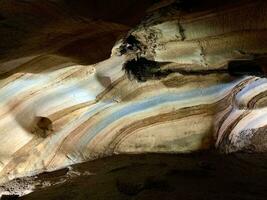 Beautiful rainbow cave in Chiang Mai province, Thailand, texture of cave wall image, cave features a natural marble color pattern on its walls photo