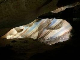 Beautiful rainbow cave in Chiang Mai province, Thailand, texture of cave wall image, cave features a natural marble color pattern on its walls photo