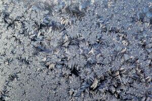 amazing frosty patterns on the window frosty background Ice on a window photo