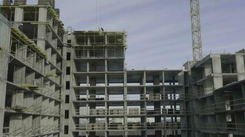 Apartments construction site with crane. Crane and building construction photo