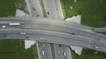 Elevated expressway. Clip. Top view at curves and lines of city highway. The curve of suspension bridge. Background scenic road photo