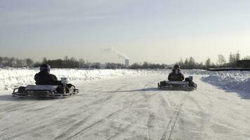 Winter competitions of kart racing on the ice of road. Go kart in winter photo