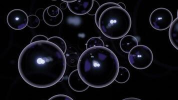 Black background. Design. Large white bubbles in animation on a dark background scatter in different directions. photo