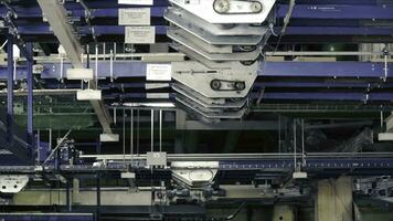 Cardboard boxes are moving on a transporter of a packaging line. Clip. Packaging lines in a warehouse of a modern factory photo