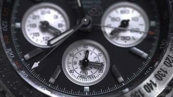 Extreme macro detail of swiss made watch shot with macro lens luxury male accessory for business. Detail of a luxury watch on black background. Selective focus, shallow depth of field. Macro shot of photo