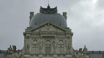 Low angle view of a gorgeous building with round shaped roof and statues. Action. Concept of architecture. photo