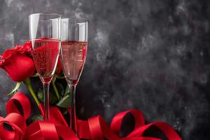 AI generated Champagne glass with rose flower bouquet and bokeh light background, Happy valentine's day concept photo