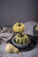 Decorative pumpkin on green background. photo