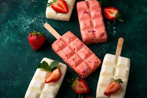 Strawberry ice cream popsicle with mint photo