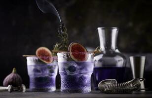 Purple fig cocktail or mocktail in glass photo