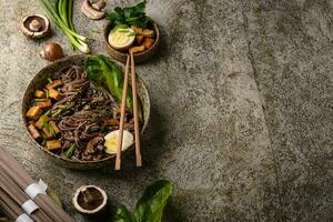 Soba noodle with tofu and mushroom photo