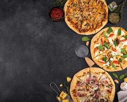 Assortment of various type of Italian pizza photo