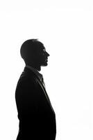 AI generated Silhouette of a thinking businessman on isolated white background photo