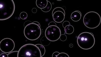 Soap bubbles floating on a black background. Design. Same size spherical silhouettes flying into the same direction. photo