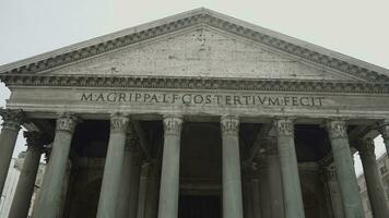 Italy, Rome - August 30, 2022. Ancient building of Roman temple. Action. View of ancient majestic building with columns. The Pantheon is architectural monument of ancient Rome photo