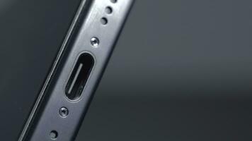 New York - September 15, 2023. Close-up of USB-C connector on iPhone. Action. Innovation in new iPhone 15 pro model with type C charging connector. New connector for iPhone 15 pro with stylish design photo