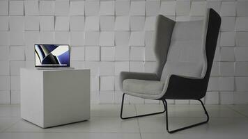 Comfortable workplace. Action. A wonderful place with a white armchair and a small table with a computer without people. photo