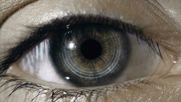 Technological lens on the eye. The concept of future technologies. Female eye with futuristic lens, macro photo