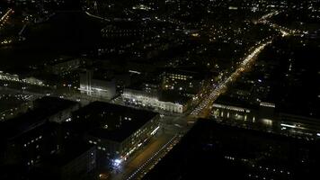 Light trails on the modern building. The life of the city at night with traffic. Concept of night life photo