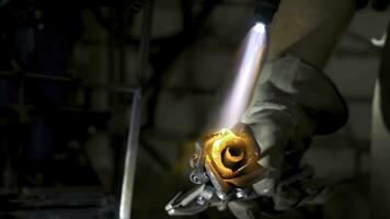 Blacksmith aligns leaves of iron rose and makes the final shape of the flower. Blacksmith makes iron rose photo