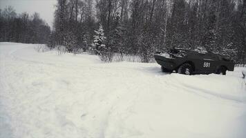 Throw a grenade in a military tank. Clip. Soldier throws a hand grenade into a battle tank or armored personnel carrier, winter backround, Soldier throws a training grenade into a tank in the winter photo