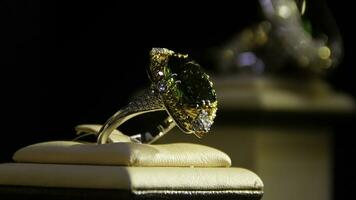 Jewelry with emeralds and diamond. Gemstones. Gold ring with emerald photo