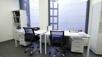 Modern, elegant office with panoramic windows and workplaces. Light office interior with tables, chairs and chests of drawers. photo