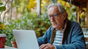 AI generated Generative AI, Senior man working with a laptop computer at the table, wearing glasses, learning to use a computer photo