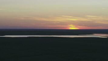 Aerial view of beautiful emerald green water lake and summer landscape sunset. Sunset on the lake photo