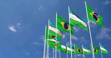 Uzbekistán y Brasil banderas ondulación juntos en el cielo, sin costura lazo en viento, espacio en izquierda lado para diseño o información, 3d representación video