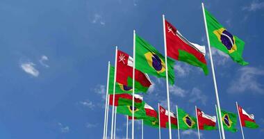 Oman and Brazil Flags Waving Together in the Sky, Seamless Loop in Wind, Space on Left Side for Design or Information, 3D Rendering video