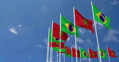 Marruecos y Brasil banderas ondulación juntos en el cielo, sin costura lazo en viento, espacio en izquierda lado para diseño o información, 3d representación video